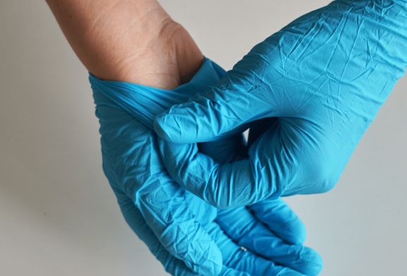 Surgeon Wearing Surgical Gloves